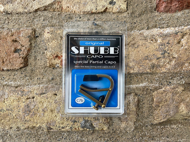 Shubb Capodastre C7/partiel - pour guitare à cordes en acier - nickel Shubb Capodastre C7/partiel - pour guitare à cordes en acier - nickel